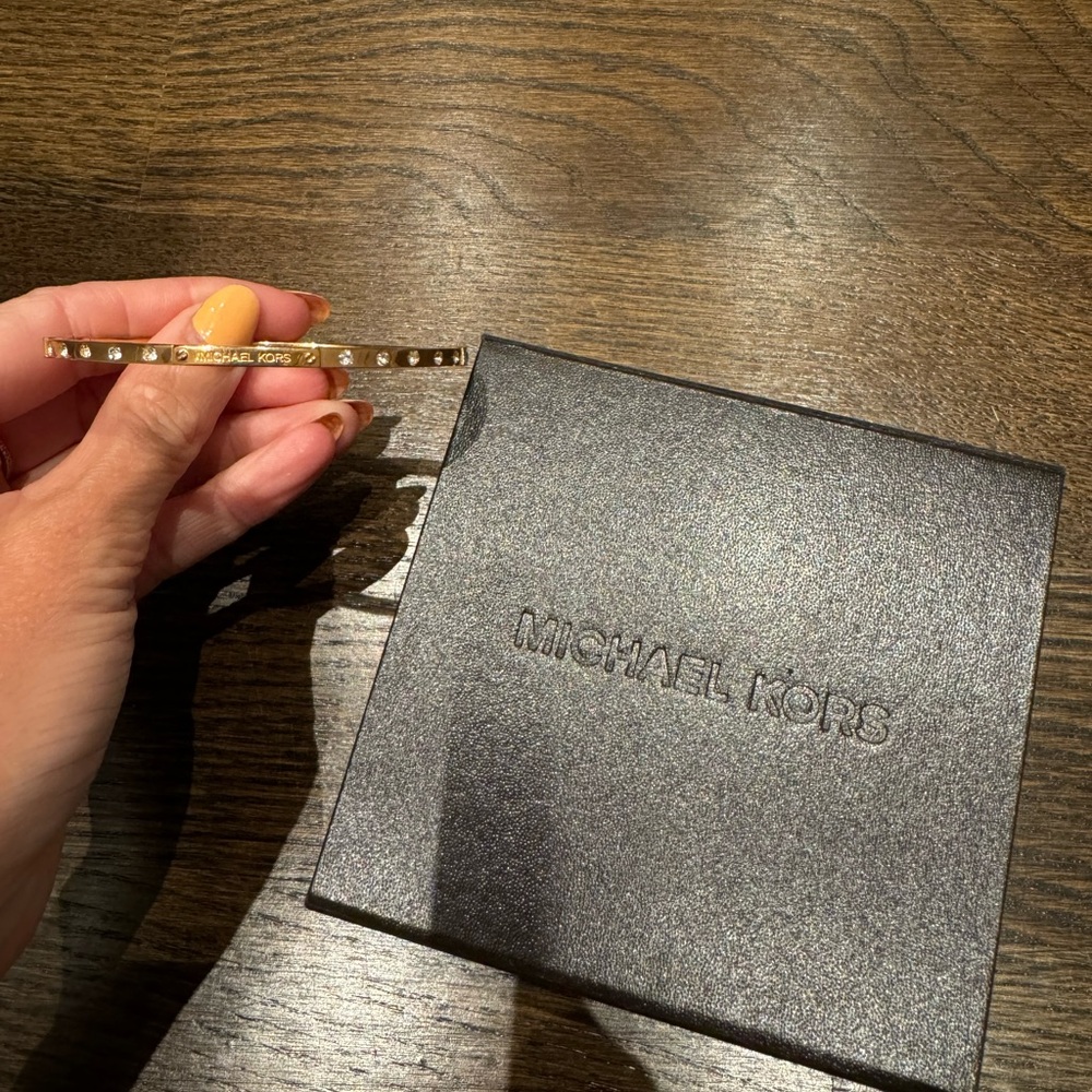 Michael Kors Gold hardware bracelet with silver gem details